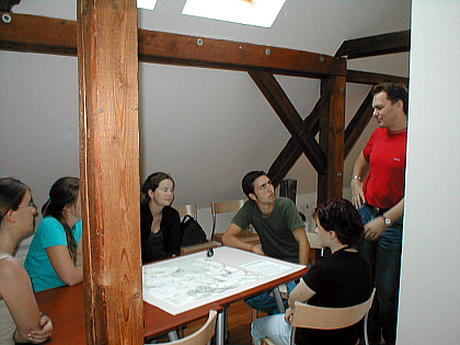 participants aound the table in the memorial
